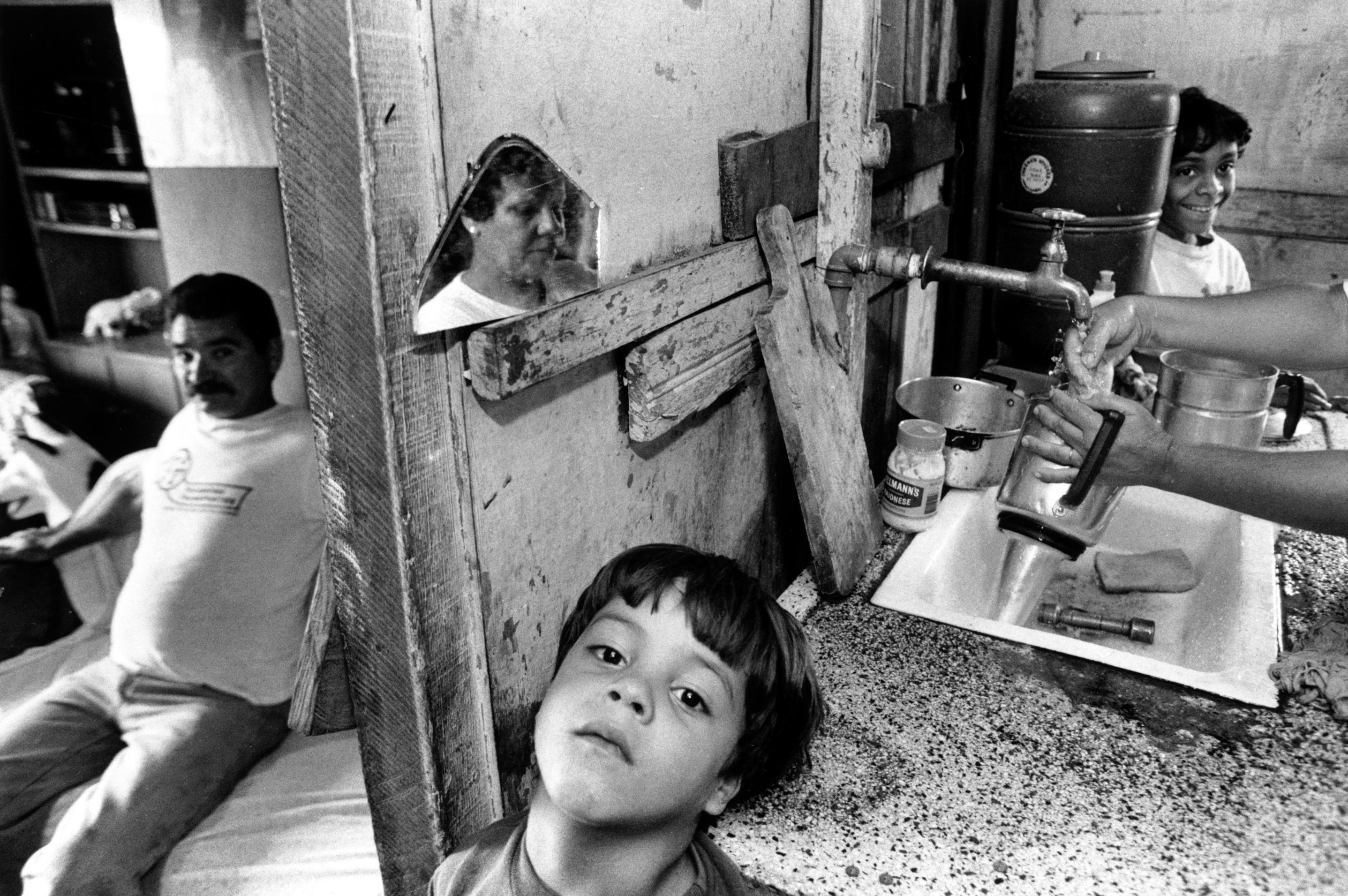 Família de migrantes na favela de Heliópolis